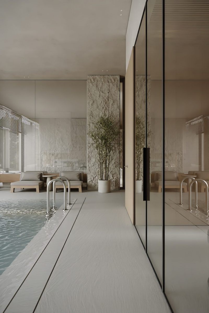 modern-indoor-pool-area-with-large-windows-lounge-chairs